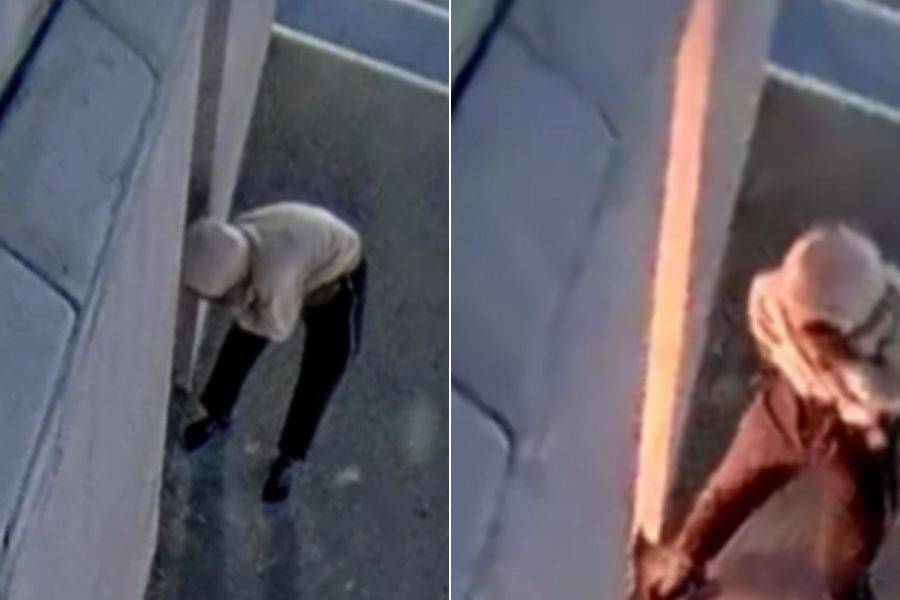 Homem tentando atear fogo na estátua da liberdade da loja Havan